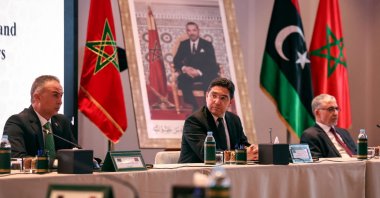 Libyan head of representative delegation to the House of Representatives Jalal Salah Abd Assalam (L), Moroccan Minister of Foreign Affairs Nasser Bourita and Libyan head of the representative delegation of the Supreme Council of the State Omar Mohamed Aboulifa (R), attend a meeting of the joint committee of the Libyan house of representatives, June 7, 2023. (AFP Photo)