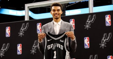 San Antonio Spurs first round pick Victor Wembanyama of France poses with his jersey during a press conference at the AT&amp;T Center, Texas, U.S., June 24, 2023. (EPA Photo)