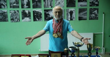 Turkish veteran table tennis player Yalçın Ünal shows off his accolades at the Altınordu Youth Center, Ordu, Türkiye, June 24, 2023. (AA Photo)