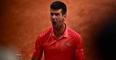 Serbia's Novak Djokovic reacts as he celebrates his victory over Norway's Casper Ruud during their men's singles final match on day fifteen of the Roland-Garros Open tennis tournament at the Court Philippe-Chatrier, Paris, France, June 11, 2023. (AFP Photo)