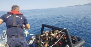 Turkish Coast Guard help irregular migrants off the coast of Ayvacık, Çanakkale, western Türkiye, June 25, 2023. (İHA Photo)