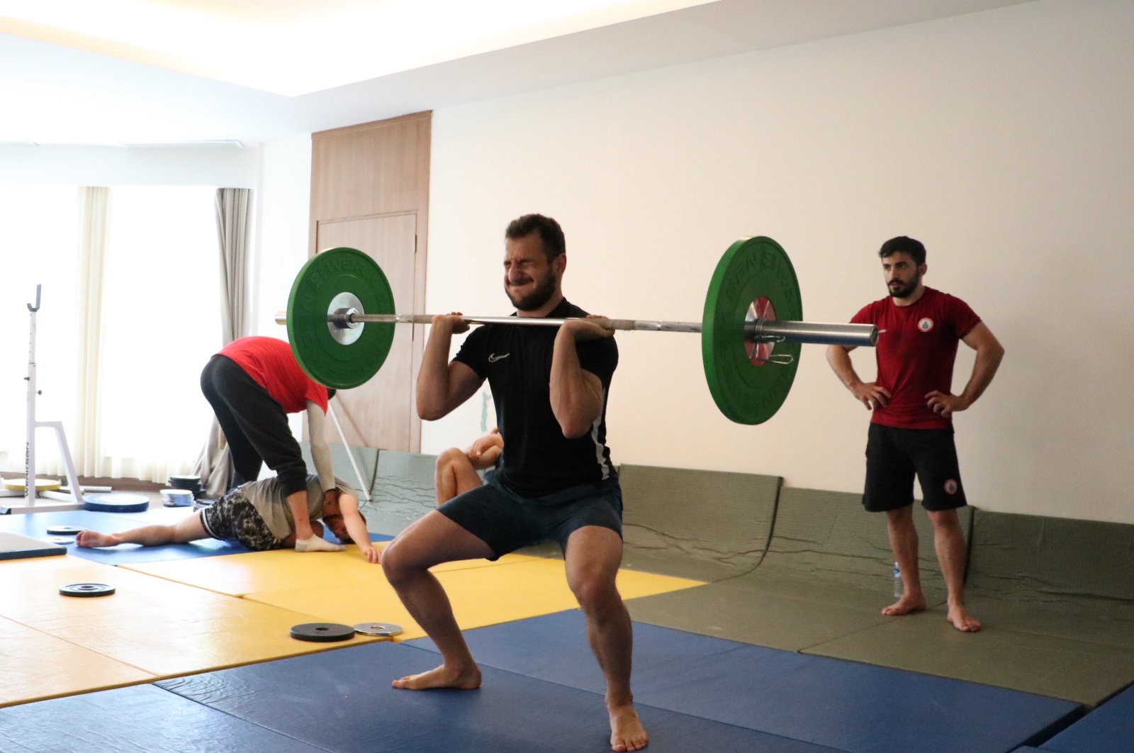 Turkish judoka Bilal Çiloğlu performs squats during a training session at a training camp on Mt. Palandöken, Erzurum, Türkiye, June 21, 2023. (AA Photo)