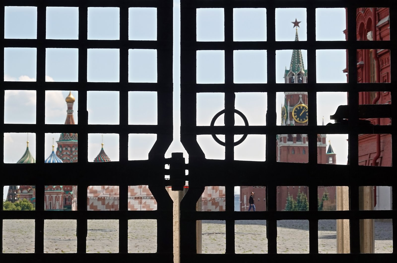 A person (C-R, rear), seen through a gate, walks in the blocked Red Square in Moscow, Russia, June 25, 2023. (EPA Photo)