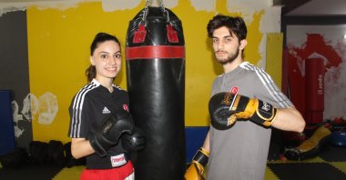Turkish kickboxers Aybüke Kılınç (L) and Ferit Özdemir pose for a photo after training ahead of the 3rd European Games, Osmaniye, Türkiye, June 24, 2023. (AA Photo)