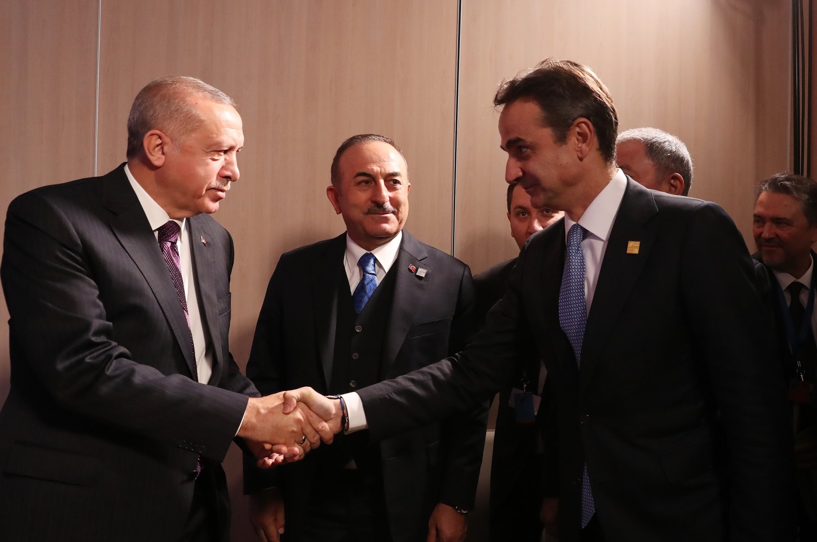 President Recep Tayyip Erdoğan shakes hands with Greek Prime Minister Kyriakos Mitsotakis for a meeting on the sidelines of a NATO leaders summit in London, United Kingdom, December 5, 2019. (AA Photo)