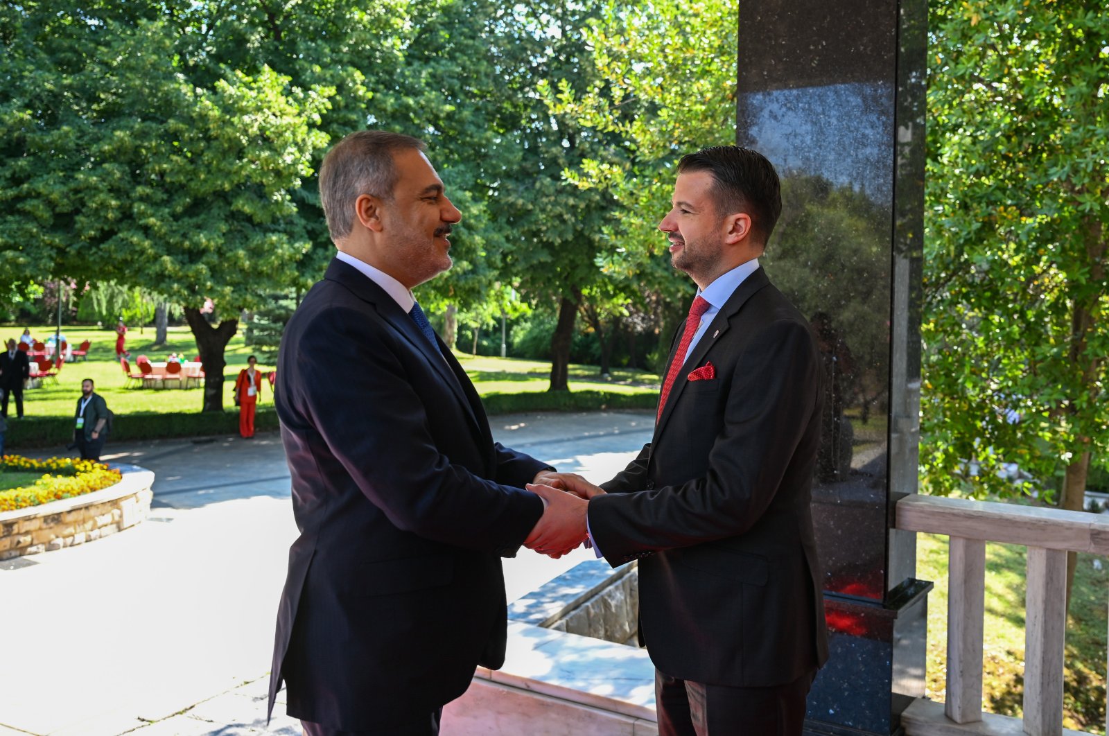 Foreign Minister Hakan Fidan (L) shakes hands with Montenegro’s President Jakov Milatovic (R) on the sidelines of the South-East European Cooperation Process (SEECP) leaders&#039; summit in the capital Podgorica, Montenegro, June 27, 2023. (AA Photo)
