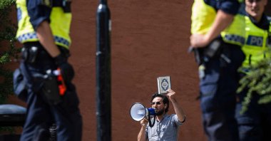 Salwan Momika prepares to desecrate Muslim holy book Quran, outside a mosque in Stockholm, Sweden, June 28, 2023. (AFP Photo)