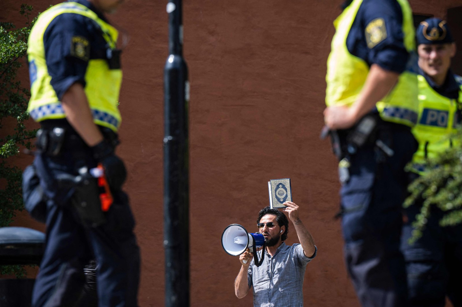 Salwan Momika prepares to desecrate Muslim holy book Quran, outside a mosque in Stockholm, Sweden, June 28, 2023. (AFP Photo)
