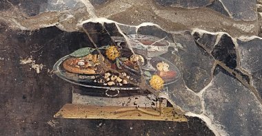 A 2,000-year-old Pompeian painting, a still life, found by the new Regio IX excavations, depicted on the wall of an ancient Pompeian house, in Pompeii, Italy, June 25, 2023. (AFP Photo)