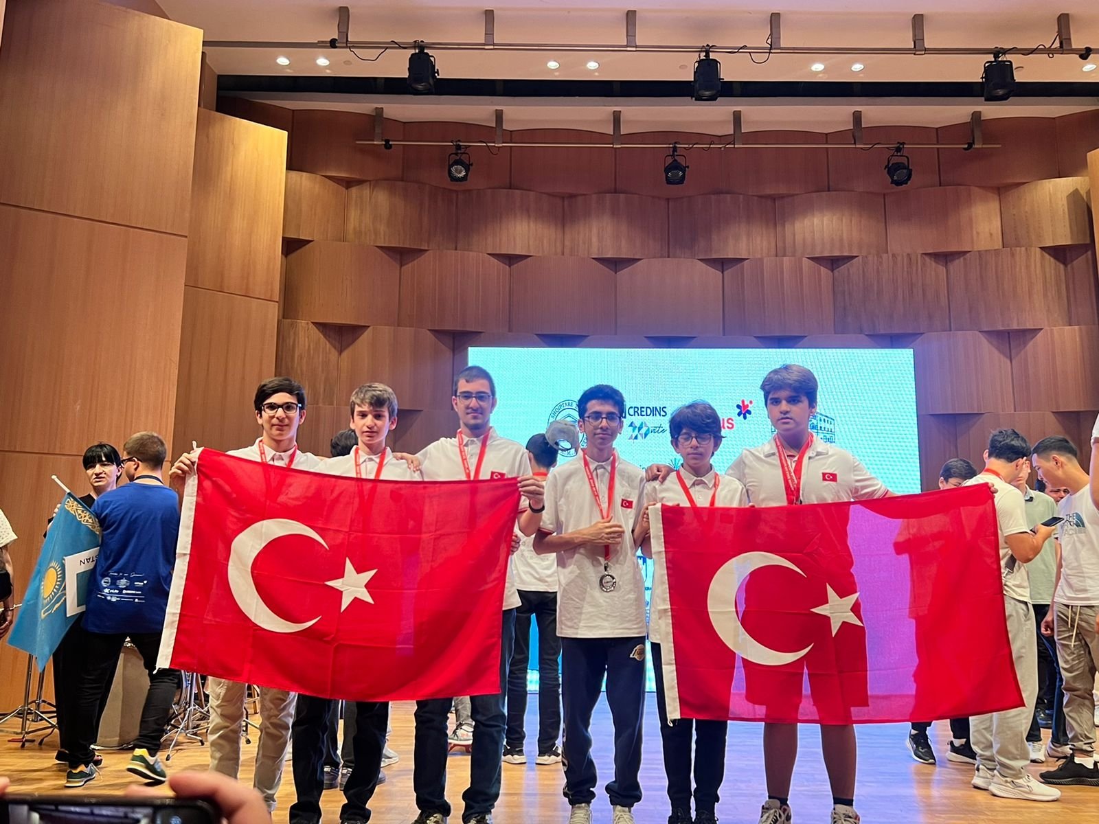 Medal winners at the 27th Young Balkan Mathematics Olympiad are photographed holding Turkish flags, Ankara, Türkiye, June 30, 2023. (DHA Photo)