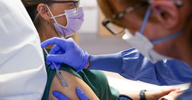 A nurse administers the third dose of an experimental breast cancer vaccine to a patient at University of Washington Medical Center, in Montlake, in Seattle, U.S., May 30, 2023. (AP Photo)