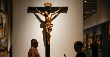 Visitors walk past &quot;Cristo en la cruz&quot; by artist Gian Lorenzo Bernini at the Gallery of Royal Collections in Madrid, Spain, June 29, 2023. (Reuters Photo)