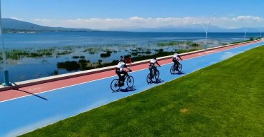 Groups of cyclists are photographed cycling on a bicycle lane established within the framework of the project under the Ministry of Environment, Urbanization, and Climate Change, Türkiye, June 30, 2023. (AA Photo)
