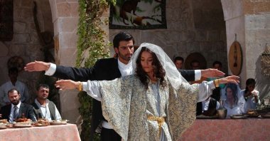 Actor Mehmet Akif Alakurt (L) and Actress Cansu Dere in a still shot from "Sıla," a Turkish TV series that is exported and broadcast abroad.