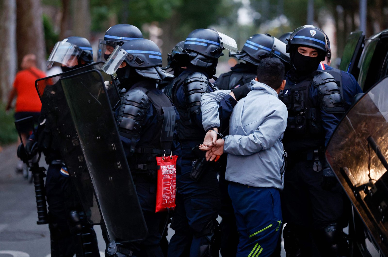 Police officers arrest a man during protests two days after a teenager was shot dead during a police traffic stop in the Paris suburb of Nanterre, Lille, France, June 29, 2023. (AFP Photo)