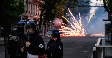 French riot police stand guard during clashes in Lyon, southeastern France, June 30, 2023. (AFP Photo)