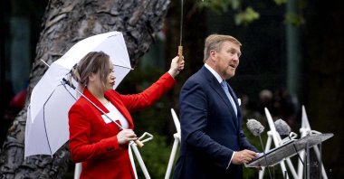 Netherlands' King Willem-Alexander (R) delivers a speech during the National Remembrance Day of Slavery in The Oosterpark, Amsterdam on July 1, 2023. (AFP Photo)
