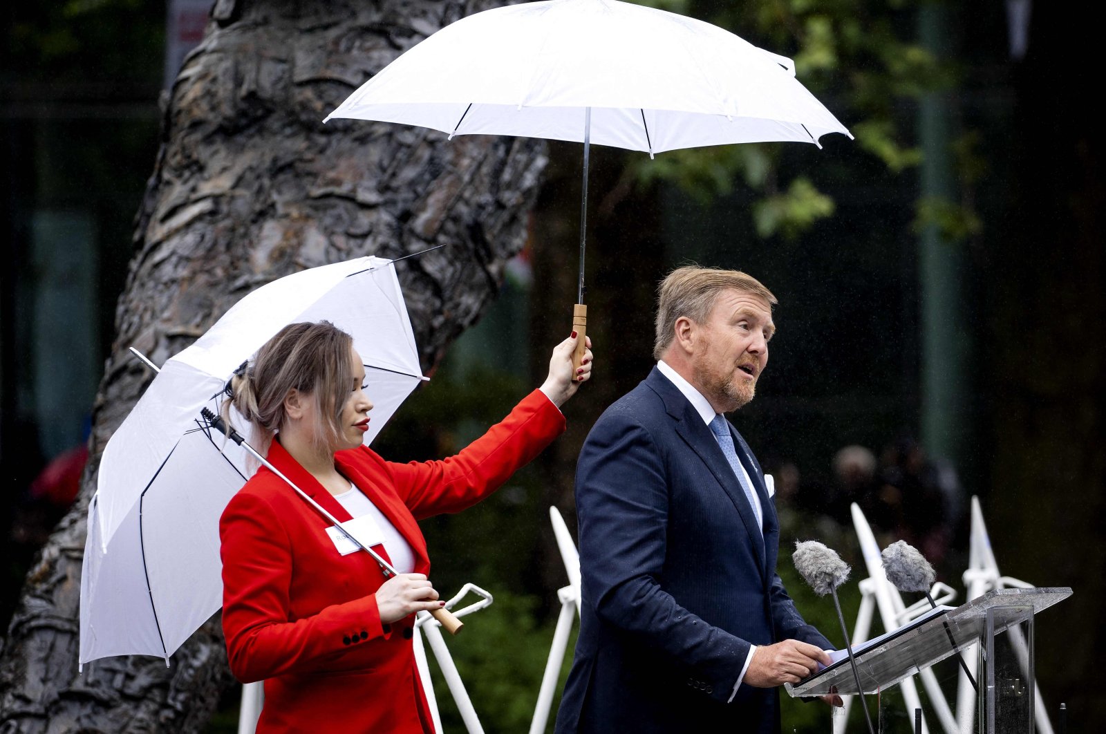 Netherlands&#039; King Willem-Alexander (R) delivers a speech during the National Remembrance Day of Slavery in The Oosterpark, Amsterdam on July 1, 2023. (AFP Photo)