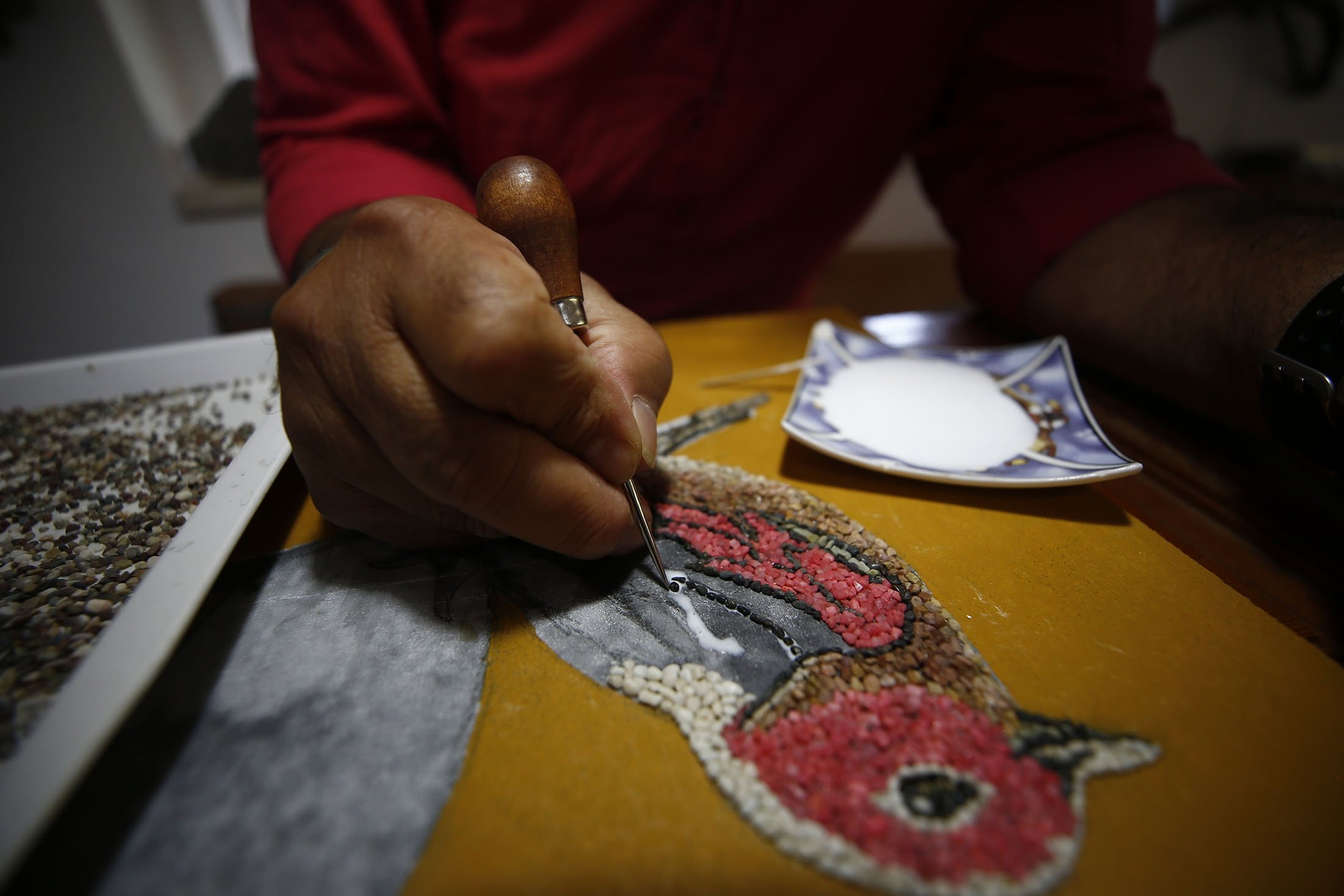 Artist Süleyman Sarı works on a project, in Antalya, Türkiye, July 2, 2023. (AA Photo)
