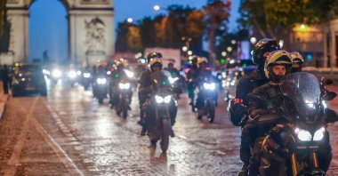 Riot police forces on motorbikes secure the area in front of the Arc de Triomphe amid fears of another night of clashes with protestors in Paris, France, July 2, 2023. (EPA Photo)