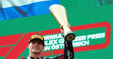 Winner Red Bull Racing&#039;s Dutch driver Max Verstappen celebrates the podium after the Formula One Austrian Grand Prix at the Red Bull race track, Spielberg, Austria, July 2, 2023. (AFP Photo)