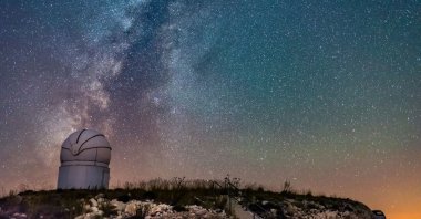 The Milky Way galaxy shines in the night sky behind Saklıkent Observatory, in Antalya, Türkiye. (Shutterstock Photo)
