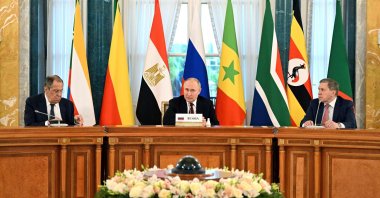 Russian President Vladimir Putin (C), his adviser Yuri Ushakov (R) and Russian Foreign Minister Sergei Lavrov (L) taking part in a meeting with delegation of African leaders at the Constantine (Konstantinovsky) Palace in Strelna, outside Saint Petersburg, Russia, June 17, 2023. (AFP Photo)
