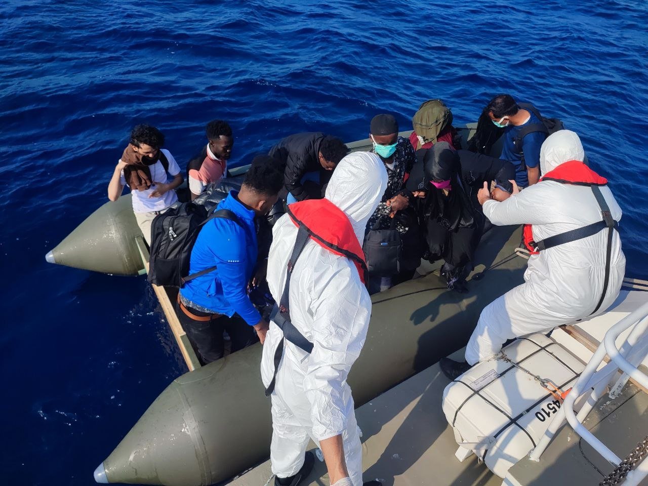 The Turkish coast guard helps a group of irregular migrants pushed back by Greece off the coast of western province Balıkesir, Türkiye, June 30, 2023. (AA Photo)