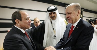 President Recep Tayyip Erdoğan shakes hands with his Egyptian counterpart Abdel-Fattah el-Sissi (L) during their meeting at the opening ceremony of the World Cup in Doha, Qatar, Nov. 20, 2022. (EPA File Photo)