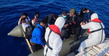 The Turkish coast guard helps a group of irregular migrants pushed back by Greece off the coast of western province Balıkesir, Türkiye, June 30, 2023. (AA Photo)
