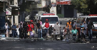 Members of Palestine Red Crescent Society (PRCS) help refugees to evacuate Jenin Camp on the second day of an Israeli military operation, Jenin, occupied West Bank, July 4, 2023. (EPA Photo)
