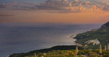 Sun sets over the coasts of the island of Gökçeada, in Çanakkale, Türkiye. (Shutterstock Photo)