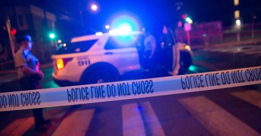 Police officials work at the scene of a mass shooting in the Kingsessing section of South Philadelphia, Pennsylvania, U.S., July 3, 2023. (EPA Photo)