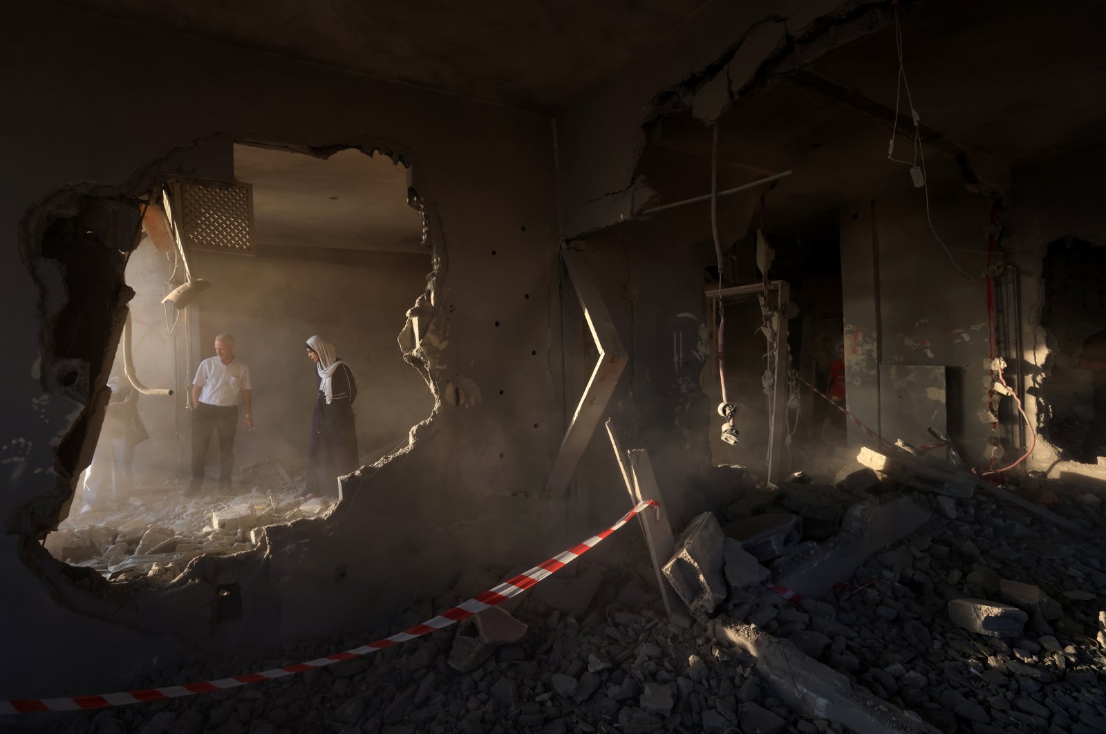 People inspect the house of Palestinian prisoner Kamal Jouri after it was destroyed during an overnight raid by Israeli forces in the occupied West Bank city of Nablus, Palestine, June 22, 2023. (EPA Photo)