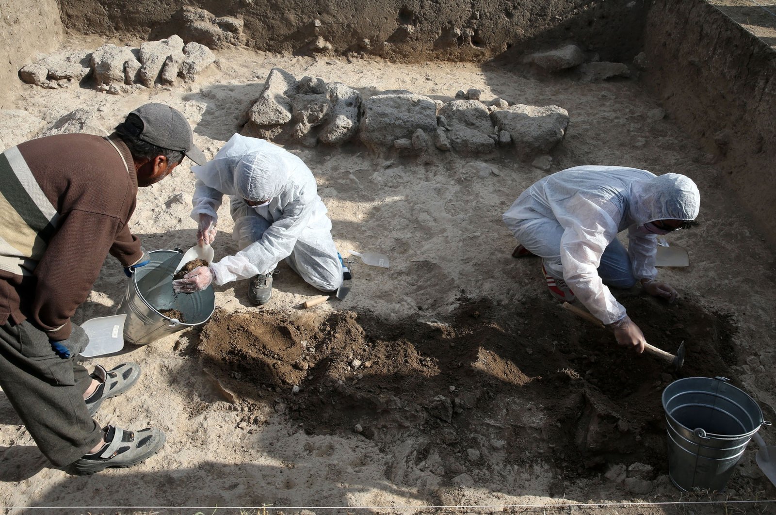 Researchers work on a site of excavation in Malazgirt district, in Muş, Türkiye, July 3, 2023. (AA Photo)