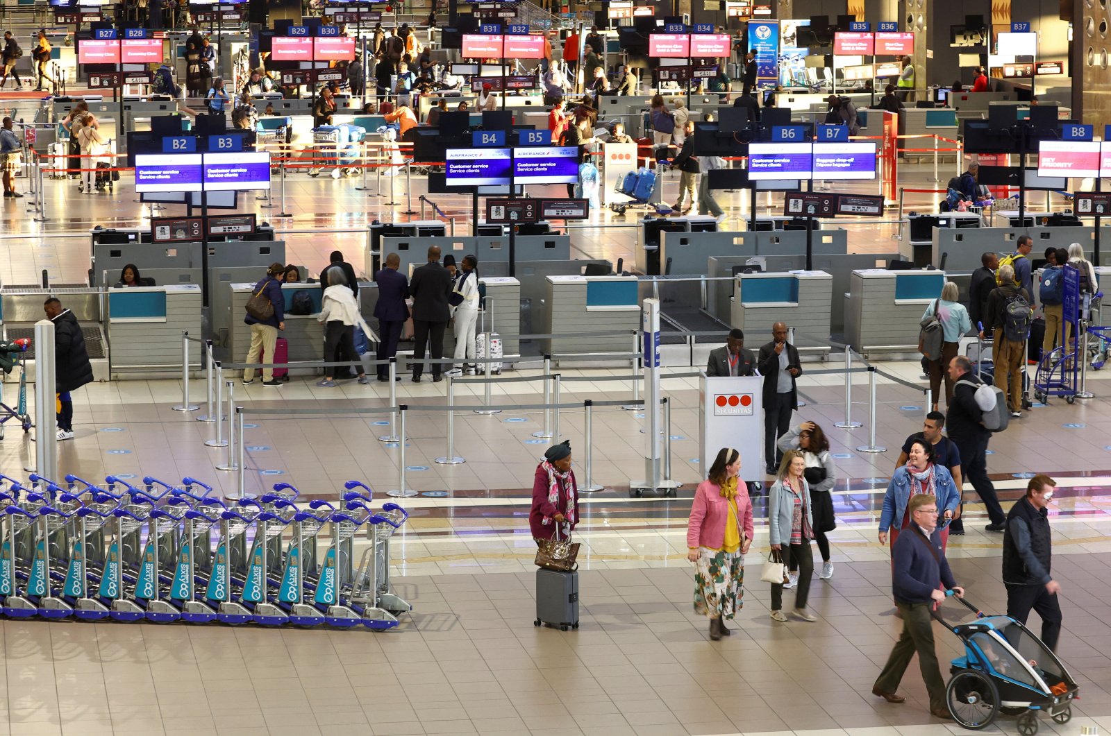 Passengers walk next to check-in counters at the O.R. Tambo International Airport, in Johannesburg, South Africa, July 3, 2023. (Reuters Photo)