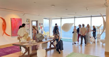 Visitors observe &quot;Cloud Nine&quot; exhibition at Mett Hotel &amp; Beach Resort, Muğla, Türkiye. (Photo by Funda Karayel) 