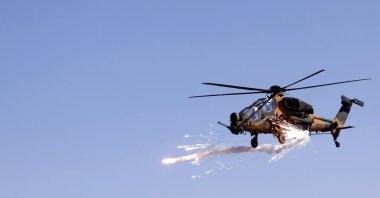 A Turkish military helicopter fires its weapons during a military exercise in Kars province, eastern Türkiye, Feb. 12, 2021. (AA Photo)