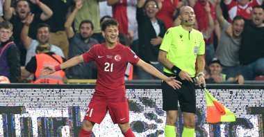 Turkish midfielder Arda Güler (L) celebrates scoring his team's second goal during the UEFA Euro 2024 qualifier group D football match against Wales at Samsun Yeni 19 mayis stadium, Samsun, Türkiye, June 19, 2023. (AFP Photo)