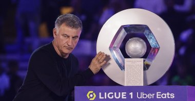 Paris Saint-Germain head coach Christophe Galtier poses with the French Ligue 1 trophy that the club won, during a ceremony following the French Ligue 1 match between Paris Saint-Germain and Clermont Foot 63, Paris, France, June 3, 2023. (EPA Photo)