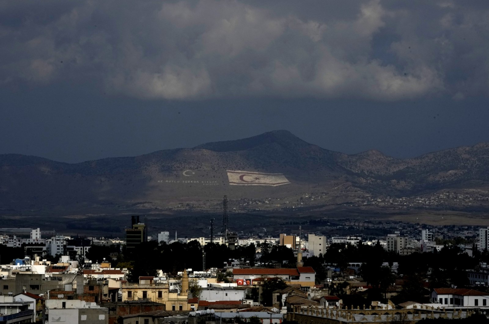 A view of Lefkoşa in the background is seen the giant TRNC flag, Nov. 15, 2022. (AP File Photo)