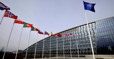 Flags of alliance members flap in the wind outside NATO headquarters in Brussels, Belgium, Feb. 28, 2020. (AP Photo)