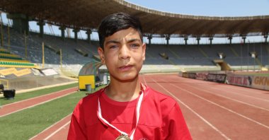 Ali Aslan poses for a photo with a medal after winning the Türkiye Visually Impaired Athletics Championship, Şanlıurfa, Türkiye, June 19, 2023. (AA Photo)