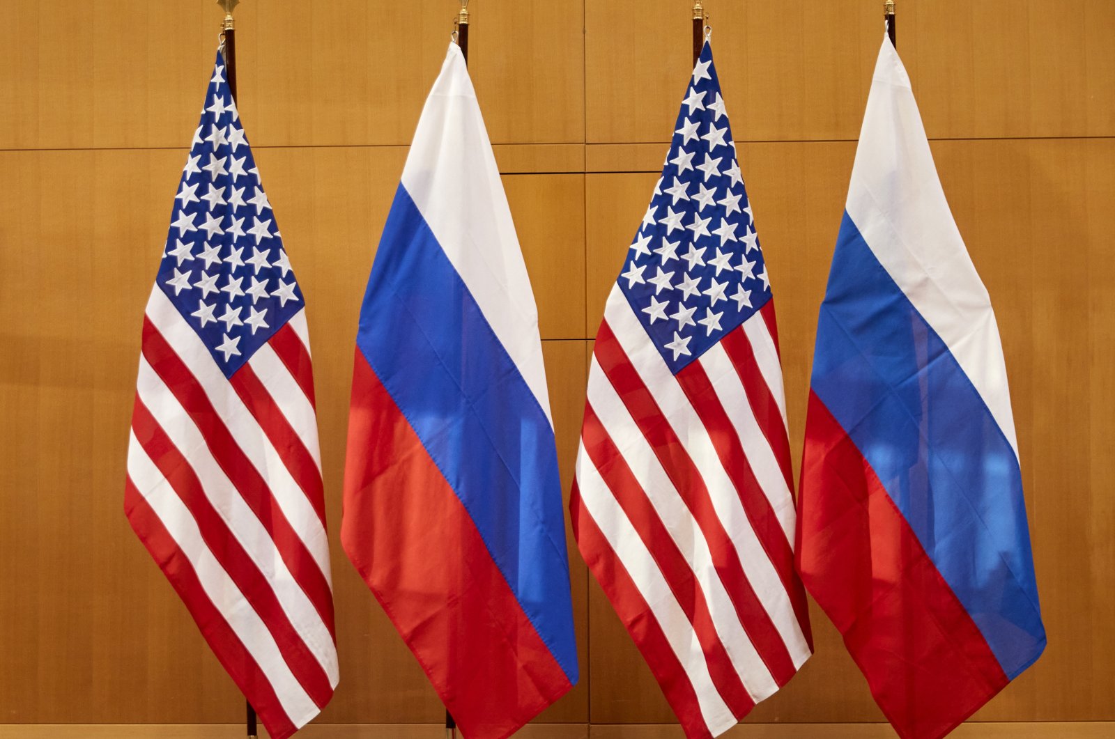 Russian and American flags displayed at the United States Mission prior to talks between deputy foreign minister Sergei Ryabkov and U.S. Deputy Secretary of State Wendy Sherman in Geneva, Switzerland, on Monday, Jan. 10, 2022. (AP File Photo)