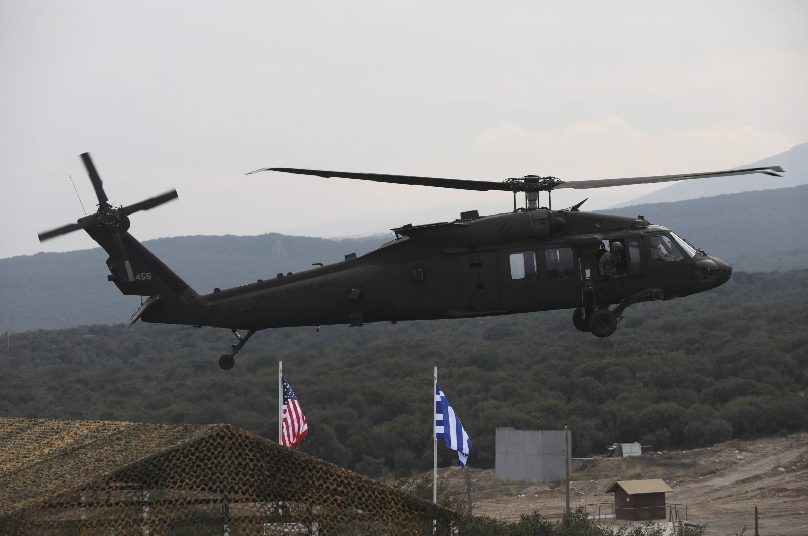 A helicopter takes part in a military drill between the aviation forces from Greece and the United States in Litochoro, northern Greece, Feb. 19, 2020. (AP Photo)