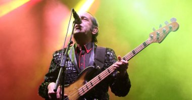 Artist Özkan Uğur plays the guitar during a performance in a concert, in Edirne, Türkiye, June 2, 2018. (AA Photo)