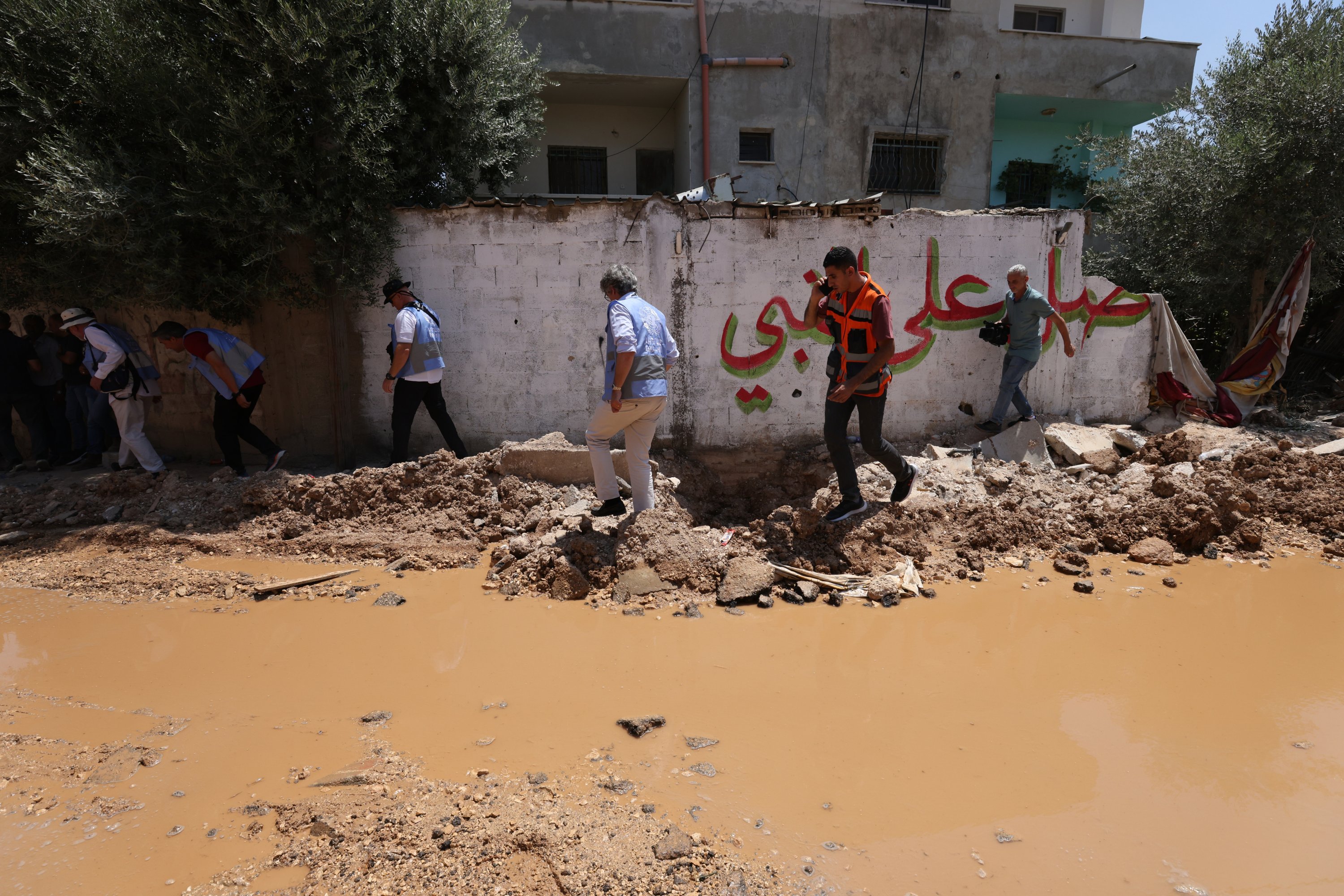 Members of the EU delegation inspect the damage at the Jenin refugee camp after an Israeli army raid, occupied West Bank, Palestine, July 8, 2023. (EPA Photo)