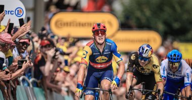 Danish rider Mads Pedersen of team Lidl-Trek (C) crosses the finish line to win the 8th stage of the Tour de France 2023, a 201km race from Libourne to Limoges, France, July 8, 2023. (EPA Photo)