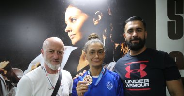 Turkish kickboxer Duygu Turan (C) shows off her medal after winning the Turkish Kickboxing Championship, Mardin, Türkiye, July 7, 2023. (AA Photo)