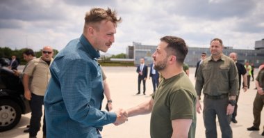 Ukrainian President Volodymyr Zelenskyy shakes hands with Azov battalion commanders at the airport, in Istanbul, Türkiye, July 8, 2023. (AA Photo) 